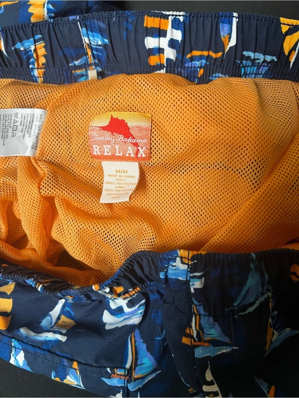 TOMMY BAHAMA RELAX NAVY TRUNKS W/ORANGE/LT BLUE SAILBOAT PRINT. MEDIUM